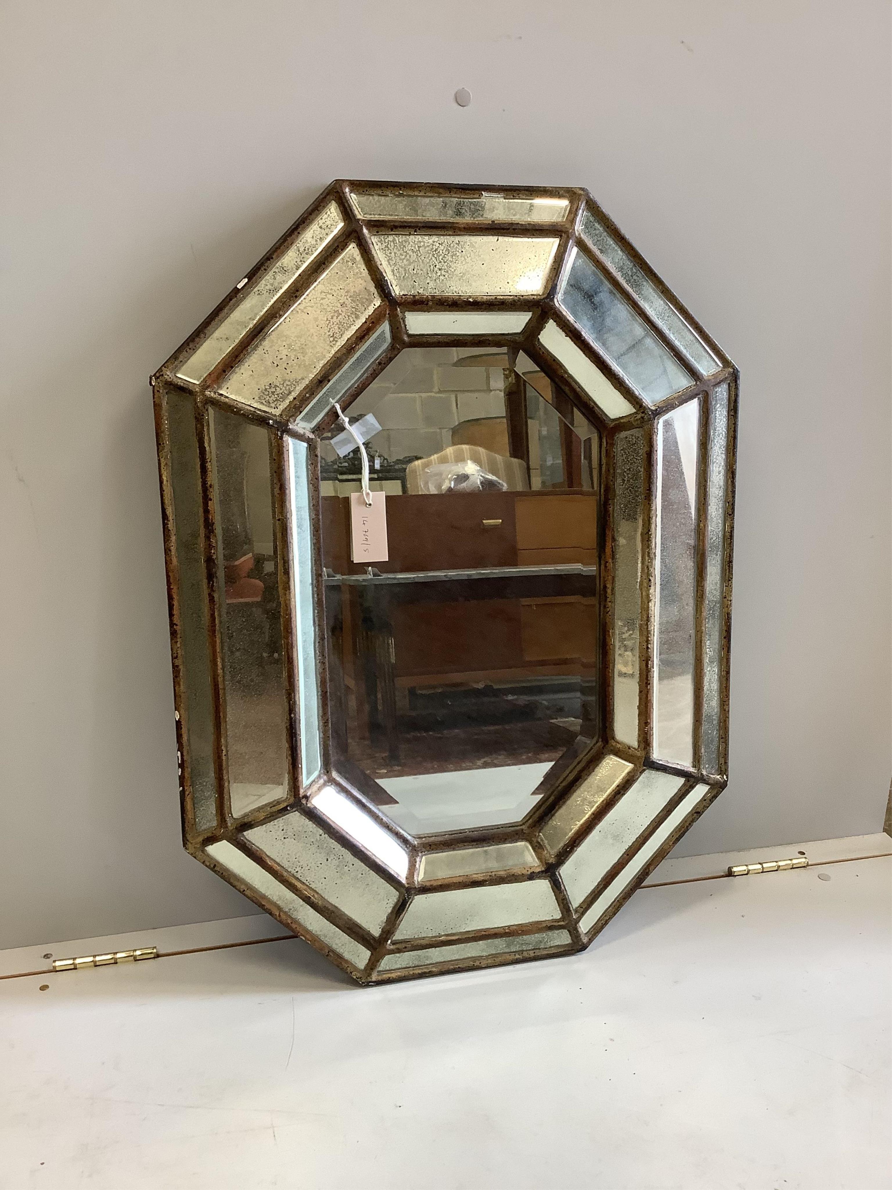 A Venetian style octagonal faceted cushion mirror, width 60cm, height 83cm. Condition - fair